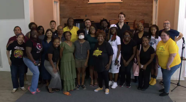 Group of activists from Houston, TX - some in campaign t-shirts - posing in a group.